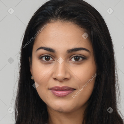 Joyful latino young-adult female with long  brown hair and brown eyes