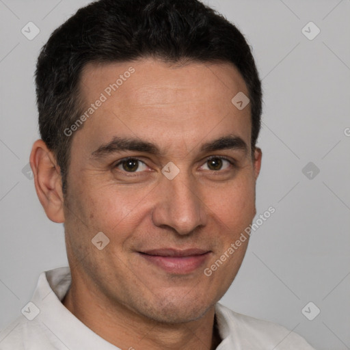 Joyful white adult male with short  brown hair and brown eyes