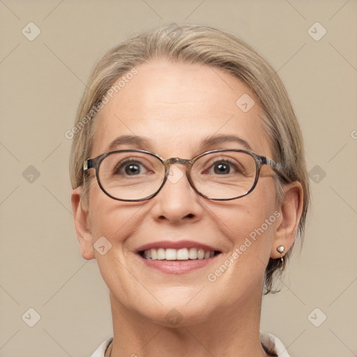 Joyful white adult female with medium  brown hair and blue eyes