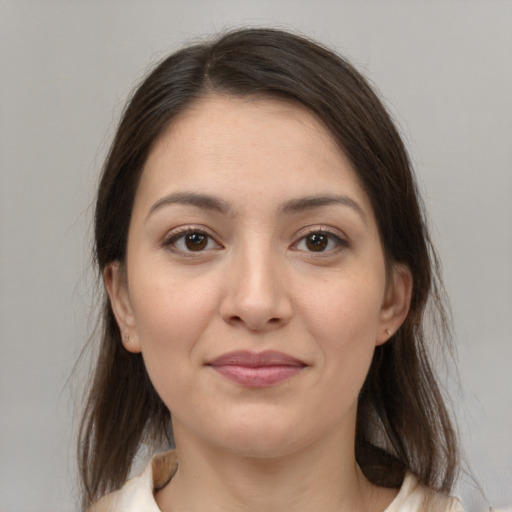 Joyful white young-adult female with medium  brown hair and brown eyes