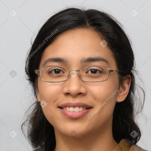 Joyful latino adult female with medium  brown hair and brown eyes