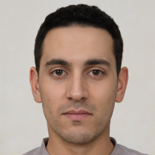 Neutral white young-adult male with short  black hair and brown eyes