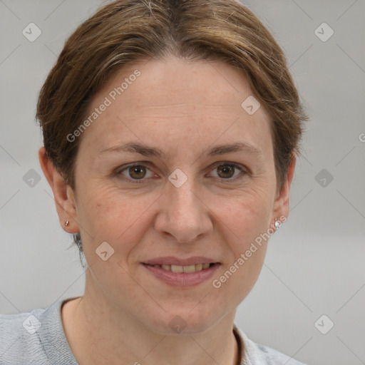 Joyful white adult female with short  brown hair and grey eyes