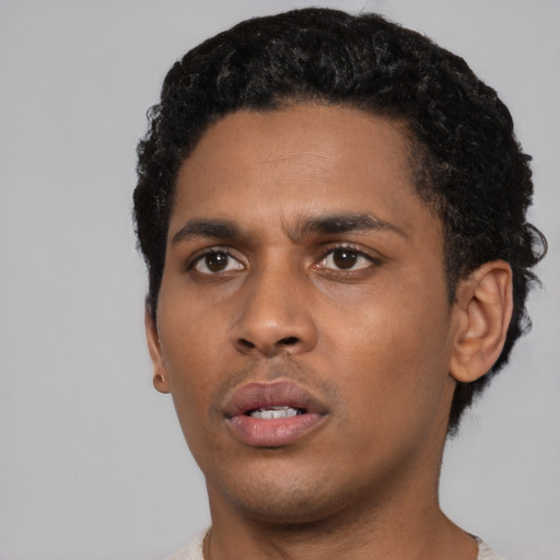Neutral black young-adult male with short  black hair and brown eyes