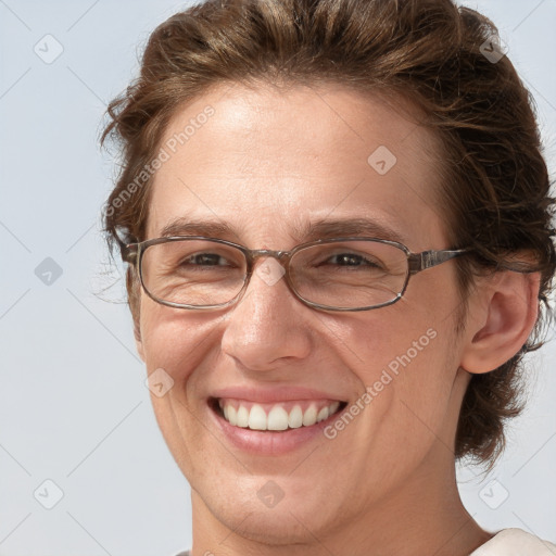 Joyful white adult female with short  brown hair and brown eyes