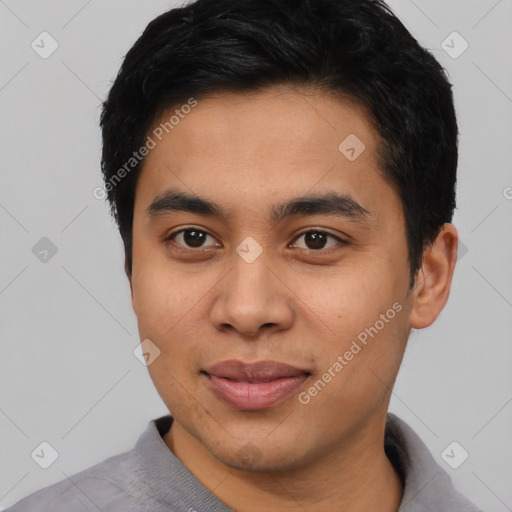 Joyful asian young-adult male with short  black hair and brown eyes