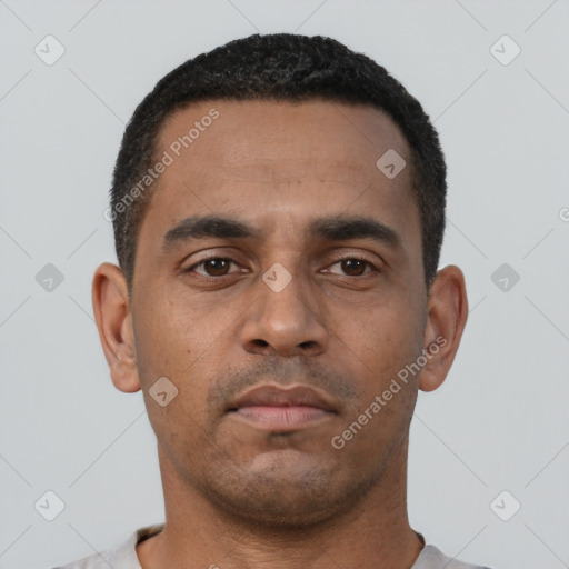 Neutral latino young-adult male with short  black hair and brown eyes