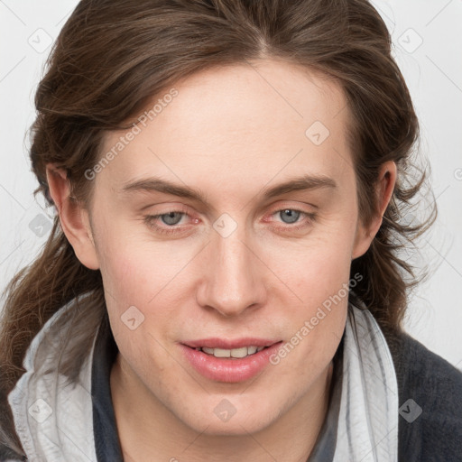 Joyful white young-adult female with medium  brown hair and blue eyes