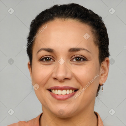 Joyful latino young-adult female with short  brown hair and brown eyes