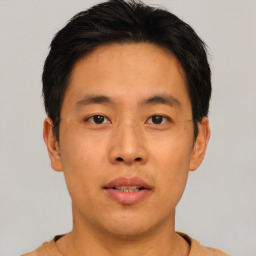 Neutral asian young-adult male with short  brown hair and brown eyes