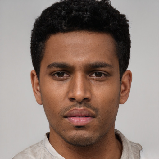 Neutral black young-adult male with short  black hair and brown eyes
