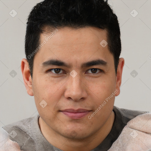 Joyful latino young-adult male with short  brown hair and brown eyes