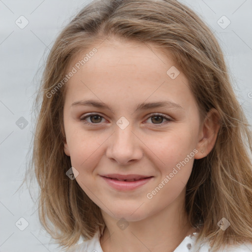 Joyful white child female with medium  brown hair and brown eyes