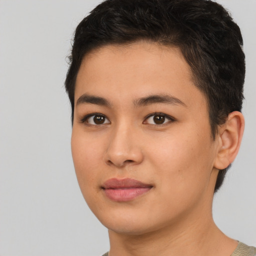 Joyful asian young-adult female with short  brown hair and brown eyes
