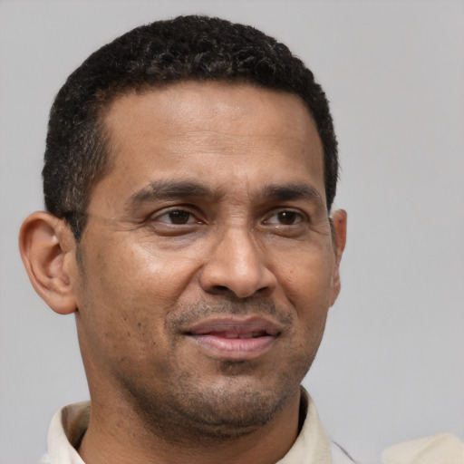Neutral latino adult male with short  brown hair and brown eyes
