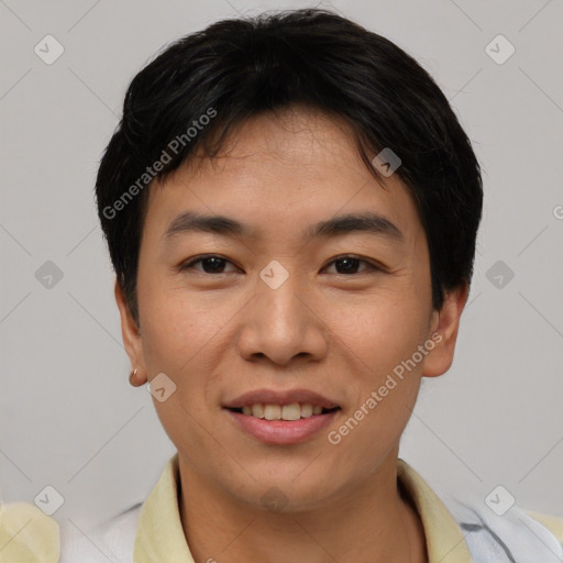 Joyful asian young-adult male with short  black hair and brown eyes