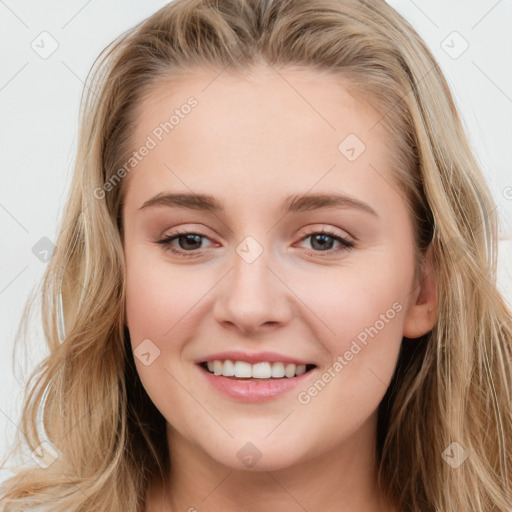 Joyful white young-adult female with long  brown hair and blue eyes