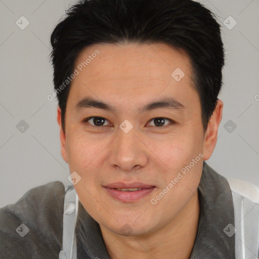 Joyful white young-adult male with short  black hair and brown eyes