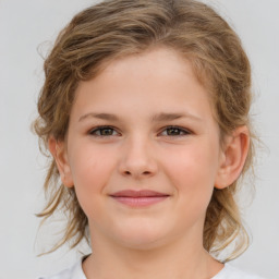 Joyful white child female with medium  brown hair and brown eyes