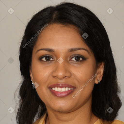 Joyful black young-adult female with long  brown hair and brown eyes