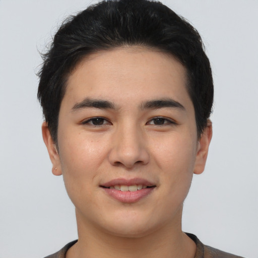 Joyful asian young-adult male with short  brown hair and brown eyes