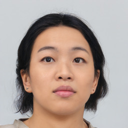 Neutral asian young-adult female with medium  brown hair and brown eyes