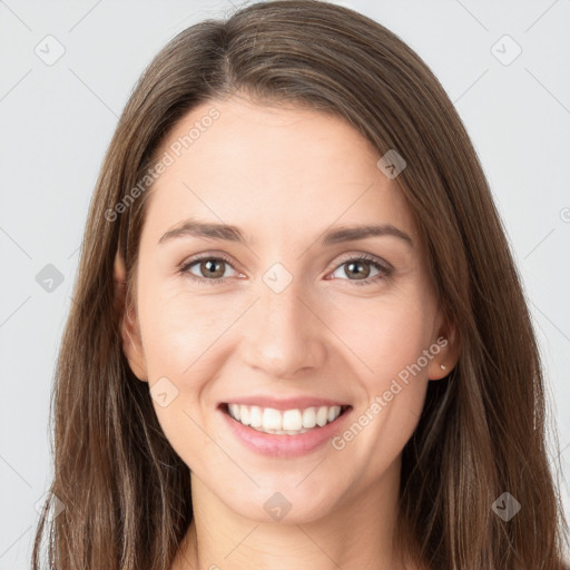 Joyful white young-adult female with long  brown hair and grey eyes