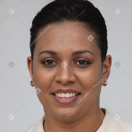 Joyful black young-adult female with short  black hair and brown eyes