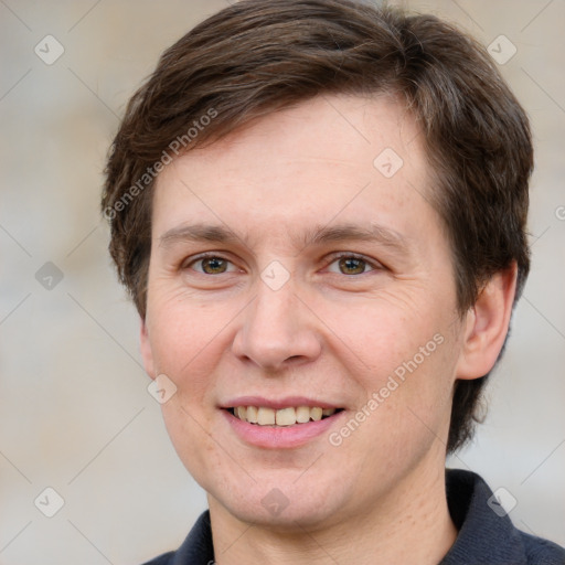 Joyful white adult male with short  brown hair and grey eyes