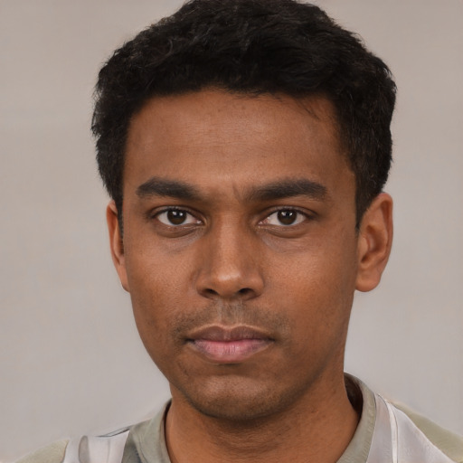 Neutral latino young-adult male with short  black hair and brown eyes