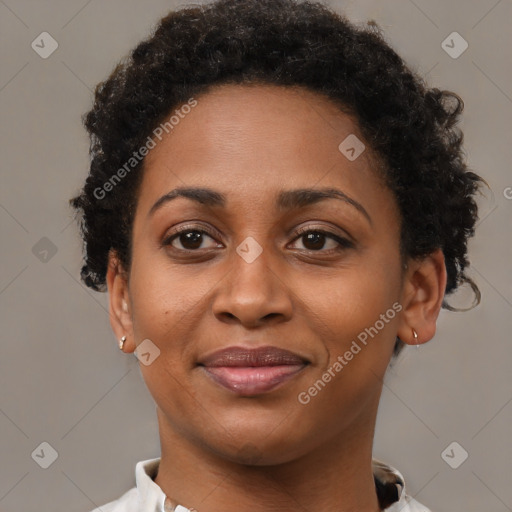 Joyful black adult female with short  brown hair and brown eyes