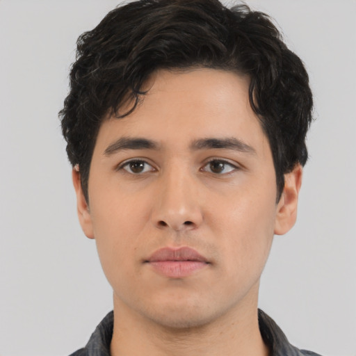 Neutral white young-adult male with short  black hair and brown eyes