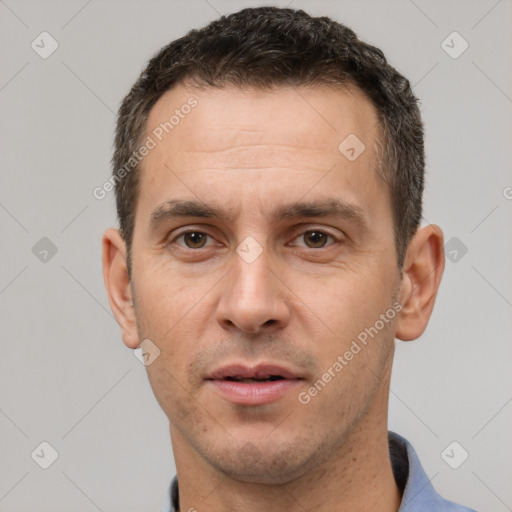 Joyful white adult male with short  brown hair and brown eyes