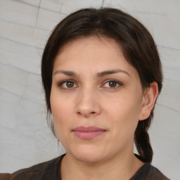 Joyful white young-adult female with medium  brown hair and brown eyes