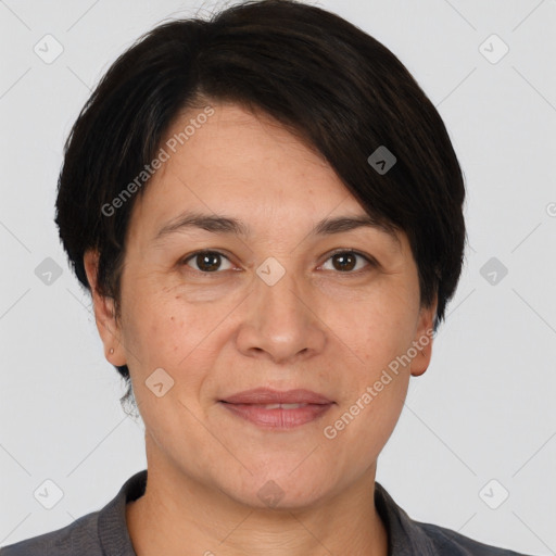 Joyful white adult female with short  brown hair and brown eyes