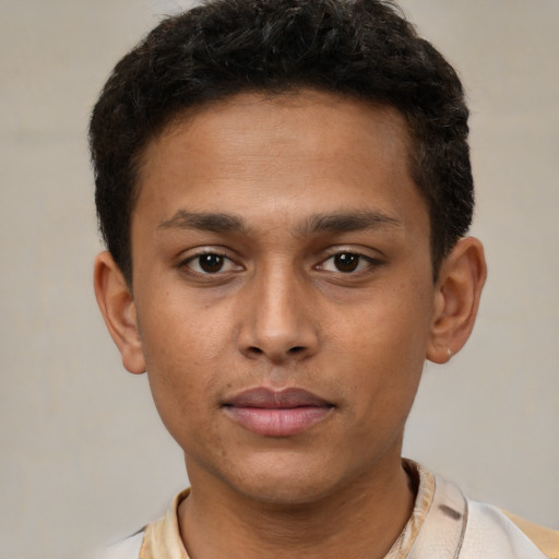 Neutral latino young-adult male with short  brown hair and brown eyes