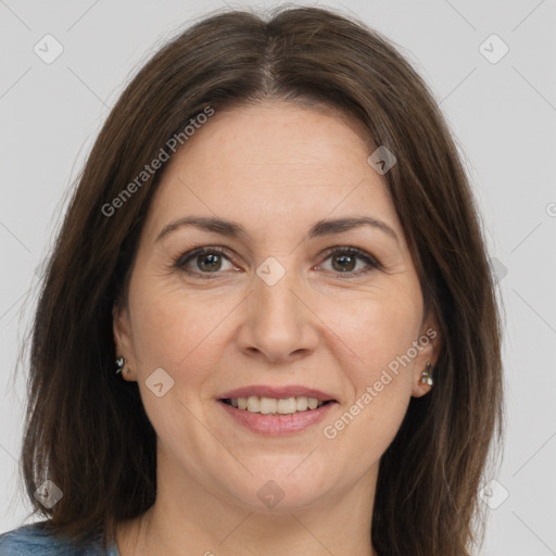 Joyful white adult female with medium  brown hair and brown eyes