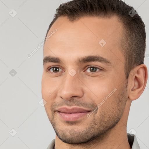 Joyful white young-adult male with short  brown hair and brown eyes