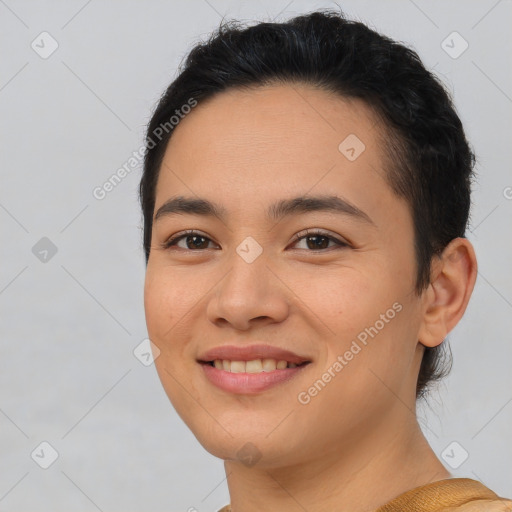 Joyful asian young-adult female with short  brown hair and brown eyes