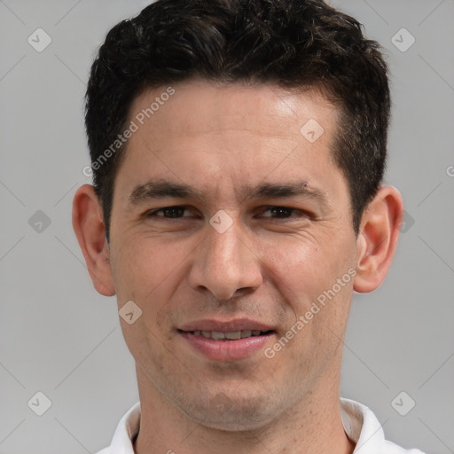 Joyful white adult male with short  brown hair and brown eyes