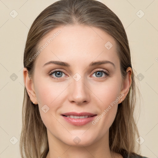 Joyful white young-adult female with long  brown hair and grey eyes