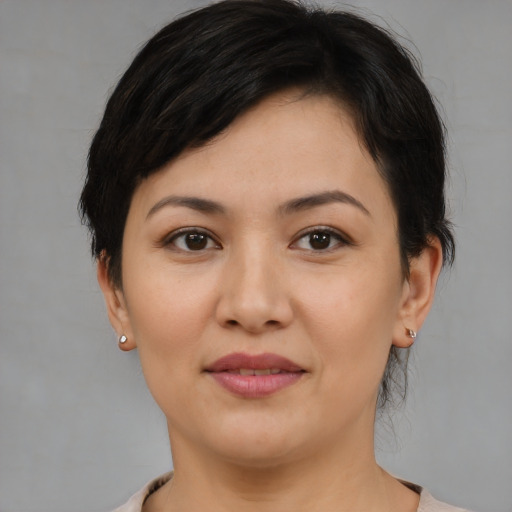 Joyful white young-adult female with medium  brown hair and brown eyes