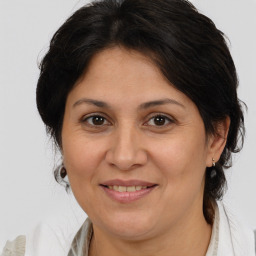 Joyful white adult female with medium  brown hair and brown eyes