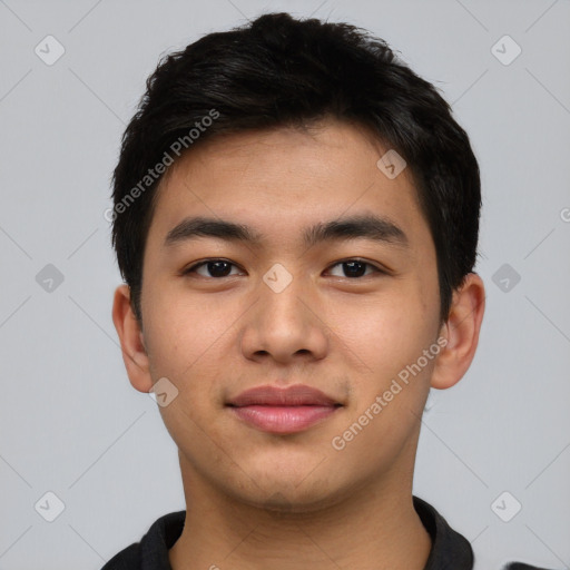 Joyful asian young-adult male with short  black hair and brown eyes