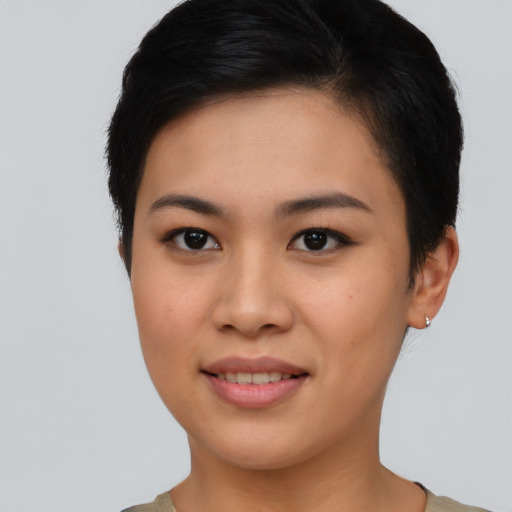 Joyful asian young-adult female with short  brown hair and brown eyes