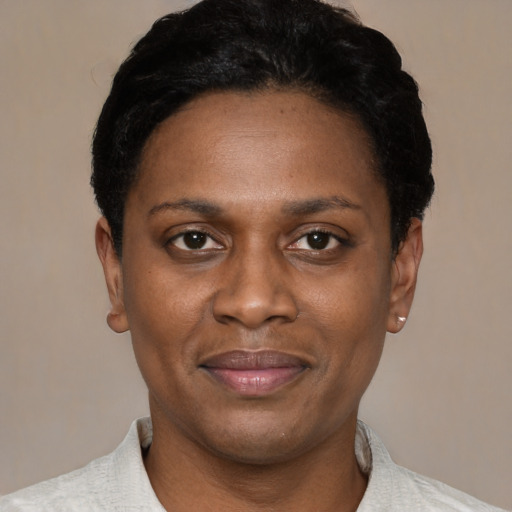 Joyful latino young-adult female with short  black hair and brown eyes