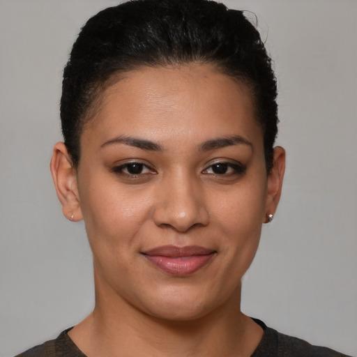 Joyful latino young-adult female with short  brown hair and brown eyes