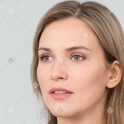 Neutral white young-adult female with long  brown hair and grey eyes