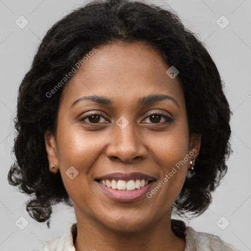 Joyful black young-adult female with long  brown hair and brown eyes