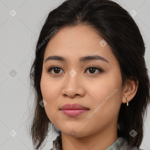 Joyful latino young-adult female with medium  brown hair and brown eyes